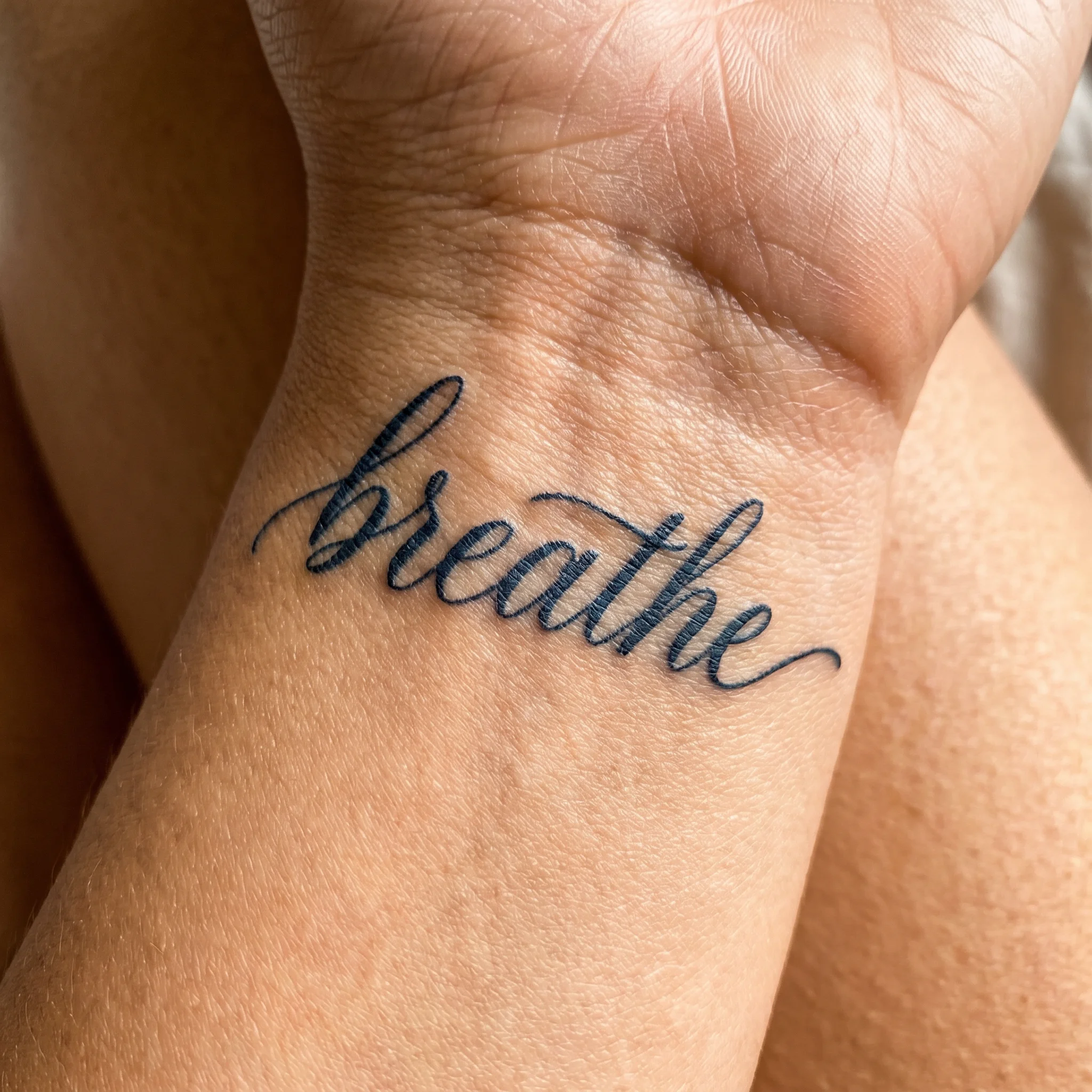 Breathe tattoo on skin