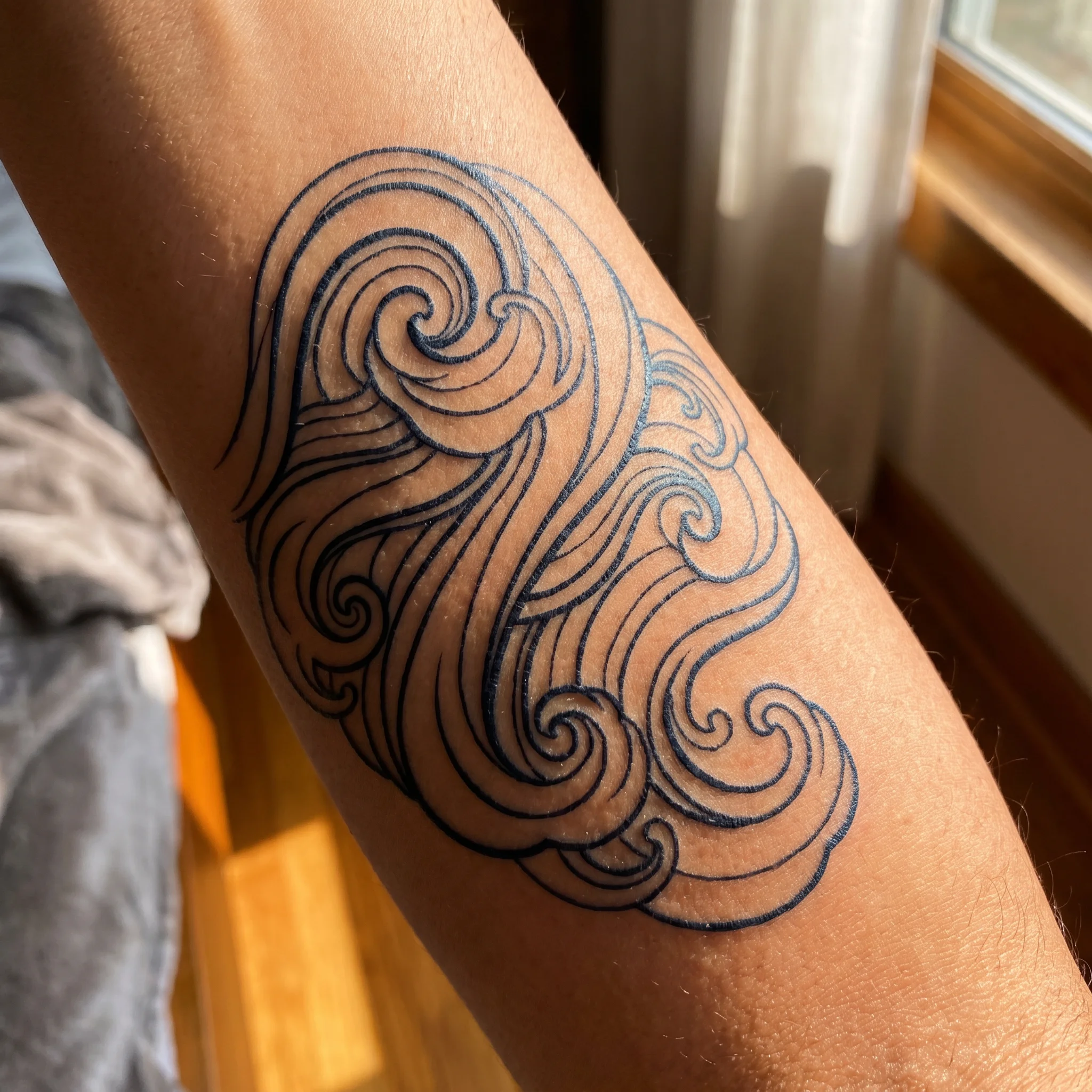 Tidal tattoo on skin